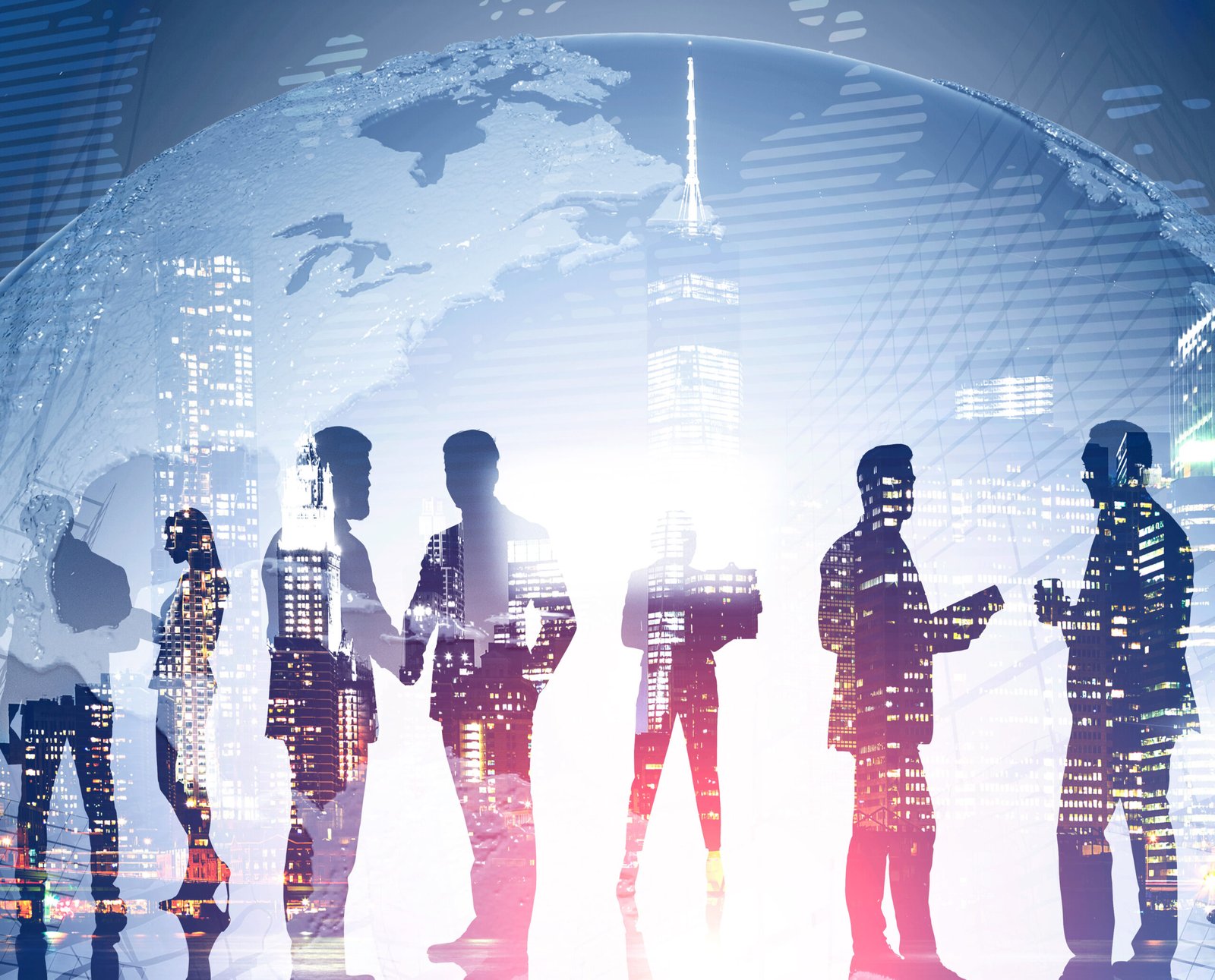Business team members standing over night city background with double exposure of planet. Concept of international company and globalization. Toned image. Elements of this image furnished by NASA